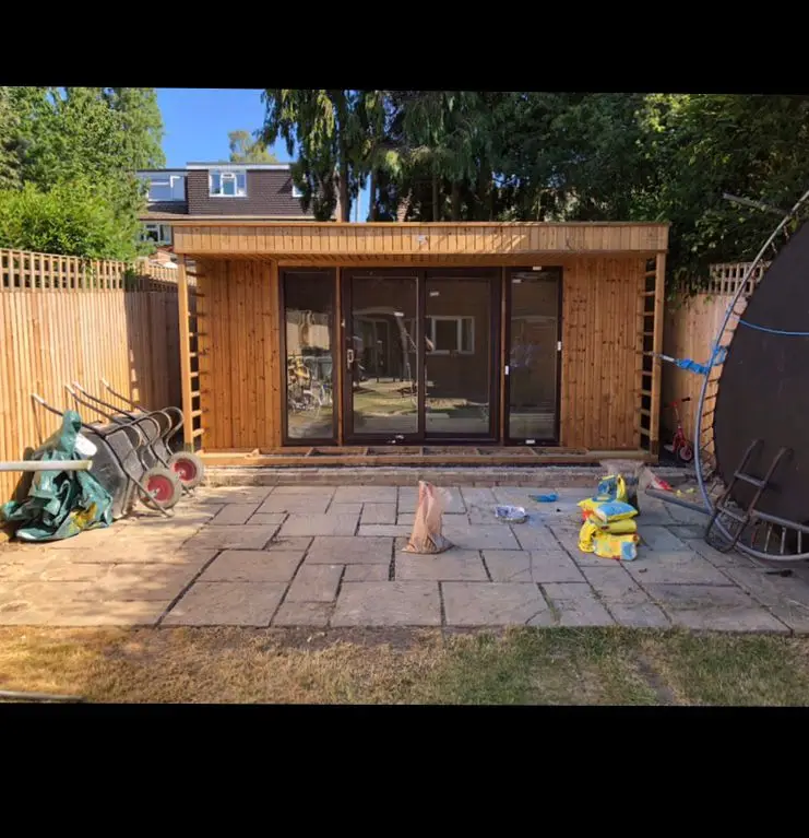 Completed landscaped garden with new lawn, patio area and full-perimeter fencing in Kent